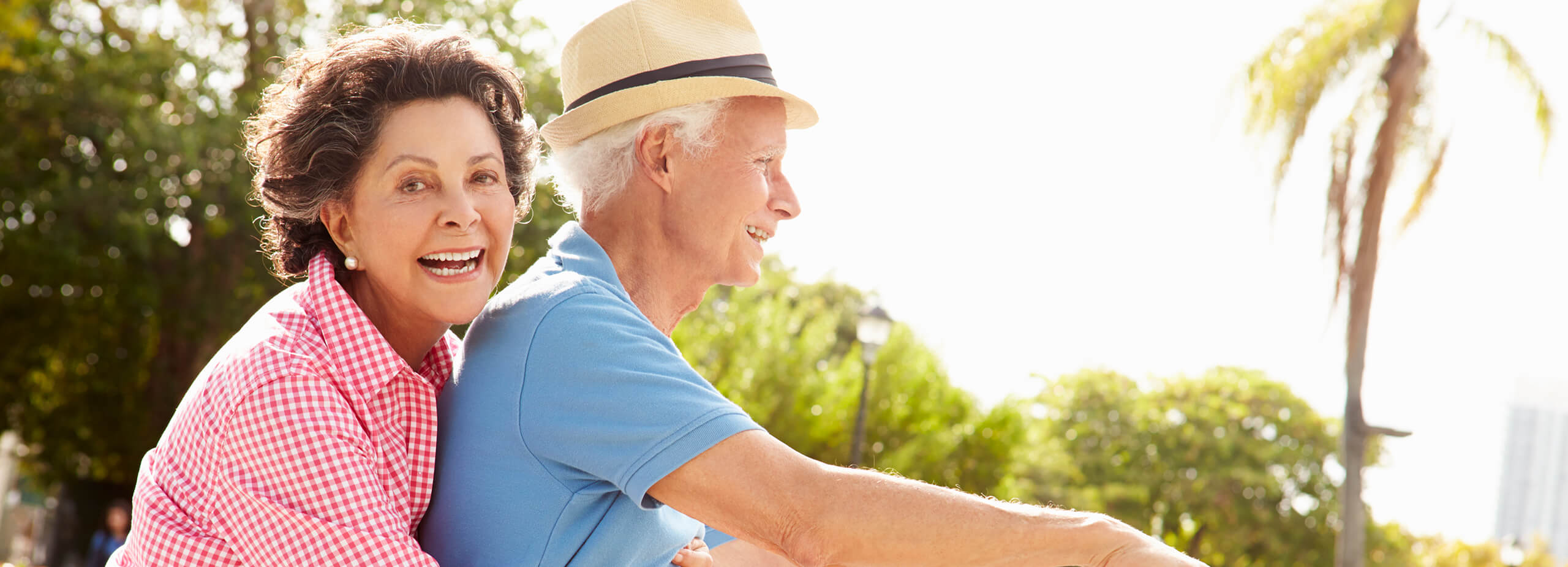 happy senior couple on a bike ride